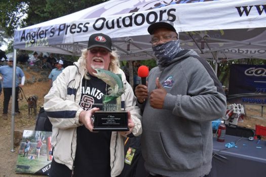 Mike Miller, with Sheldon Bright, holds up the custom trophy he was awarded for winning the NTAC event at Collins Lake on April 24 when he caught a 6.40-pound rainbow.
