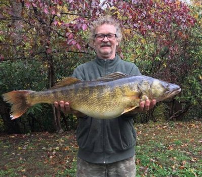 Richard " The Breeze" Nicholson holds a 34-inch, 18.1 pound walleye he caught Oct. 28, 2021, on the Youghiogheny River in Fayette County.