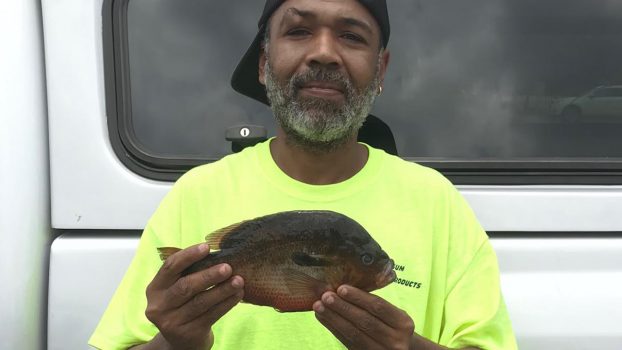 Man sets fishing record with 2 pound catch