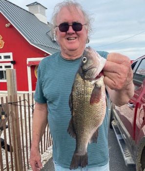 Ocean Pines angler Robert Hudson shows off his record white perch caught recently in the Isle of Wight Bay near Ocean City.