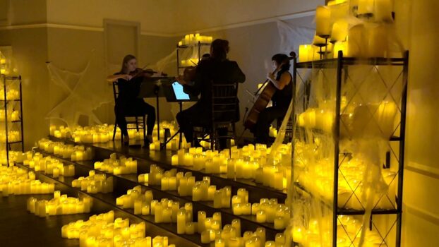 Classical musicians play pop music by candlelight in Orlando